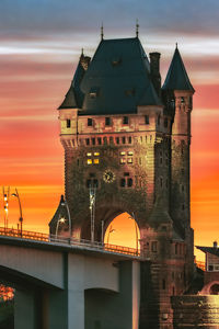 View of illuminated building against sky during sunset