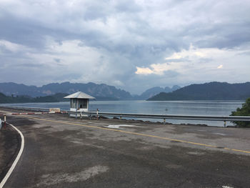 Scenic view of beach by sea against sky