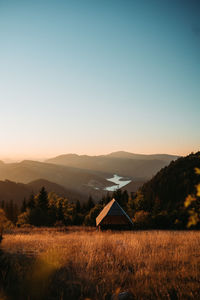 Scenic view of field against sky during sunset