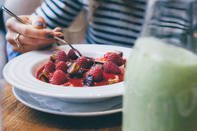 High angle view of woman eating healthy food