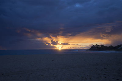 Scenic view of sea against cloudy sky