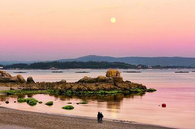 Scenic view of sea against sky at sunset