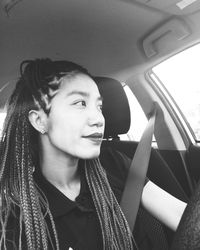 Portrait of boy sitting in car