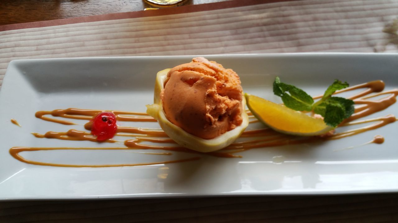 CLOSE-UP OF FRUITS SERVED ON TABLE