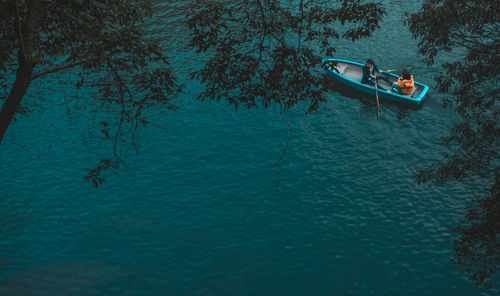 High angle view of people boating in sea