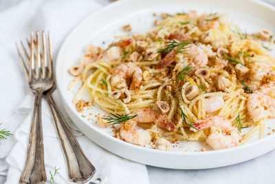 High angle view of pasta in plate on table