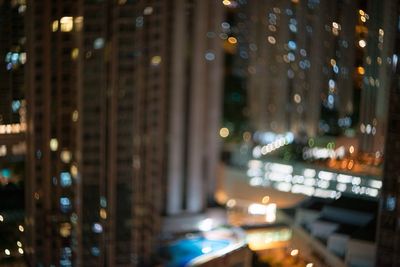 Defocused image of illuminated city at night