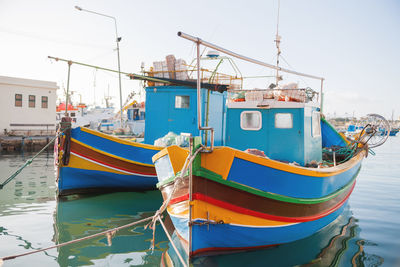 Mediterranean traditional colorful boats luzzu. fisherman village in the south east of malta. 
