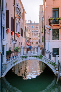 Canal amidst buildings in city