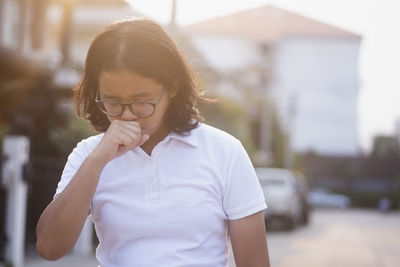 Portrait of boy wearing hat standing outdoors