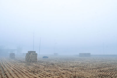 Scenic view of field against sky during winter