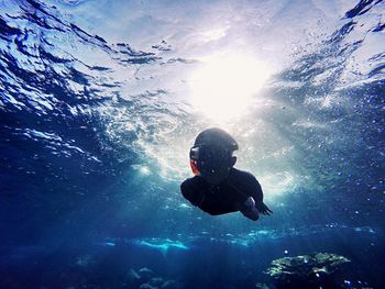 Boy swimming in water