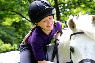 Boy riding horse