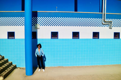 Rear view of woman walking on street