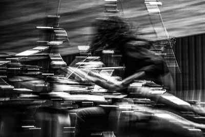 Close-up of man playing piano