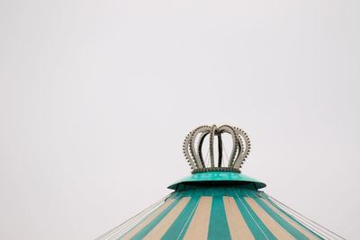 Low angle view of ferris wheel against sky