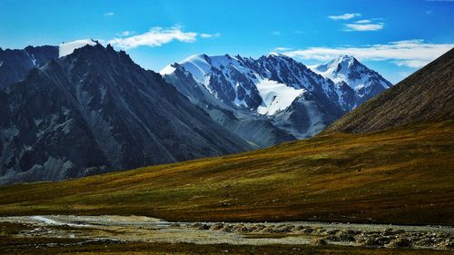 Scenic view of snowcapped mountains against sky