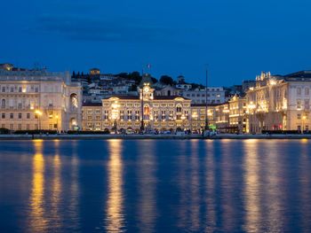 Illuminated buildings in city at night