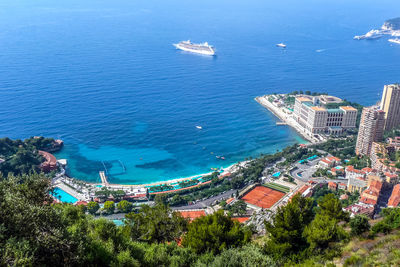 High angle view of buildings by sea