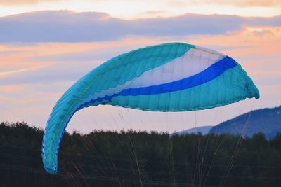 Low angle view of multi colored umbrella against sky