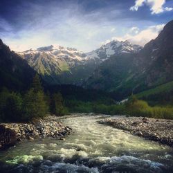 Scenic view of river flowing through rocks