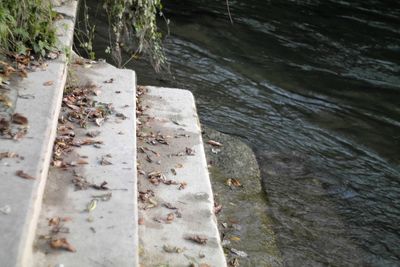 Scenic view of river by cliff