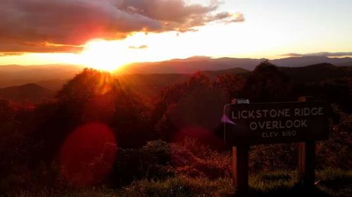 Scenic view of mountains against sky at sunset