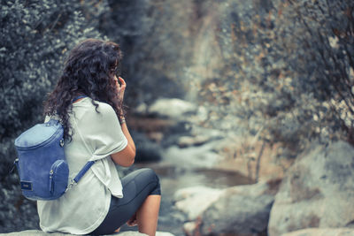 Woman standing on rock