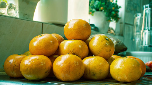 Close-up of oranges in container