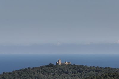 Scenic view of sea and buildings against sky