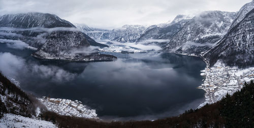 High angle view of lake amidst mountains during winter