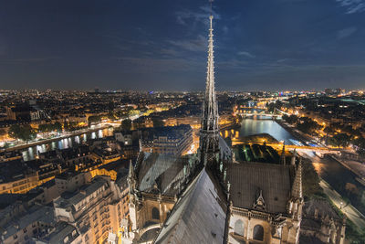 High angle view of city lit up at night