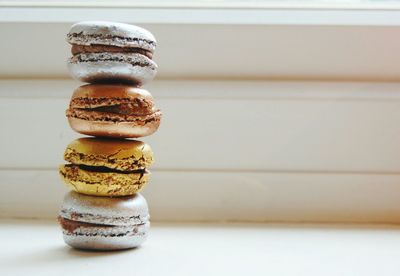 Stack of macaroons against wall