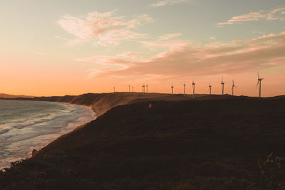 Scenic view of beach against sky during sunset