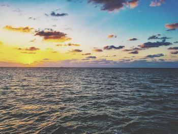 Scenic view of sea against sky at sunset