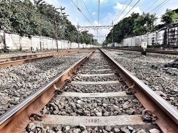 Surface level of railroad tracks against sky