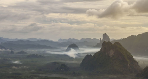 View of mountain range against cloudy sky