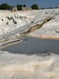 Scenic view of salt terraces landscape against sky in pamukkale turkey 