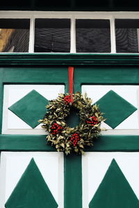 Close-up of potted plant on window of building