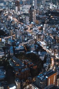 High angle view of illuminated buildings in city at night