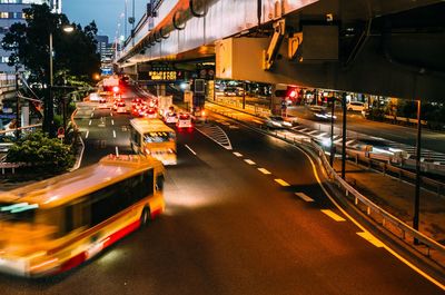 Cars on road in city at night