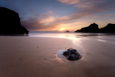 Scenic view of sea at sunset
