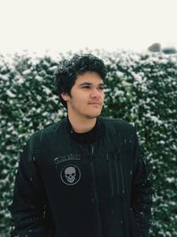 Portrait of young man standing outdoors