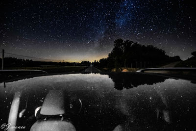 Scenic view of snow against sky at night