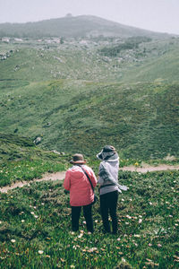 Women walking on landscape