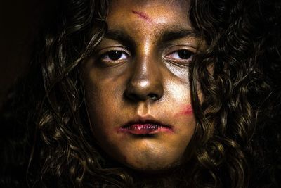 Close-up portrait of injured girl