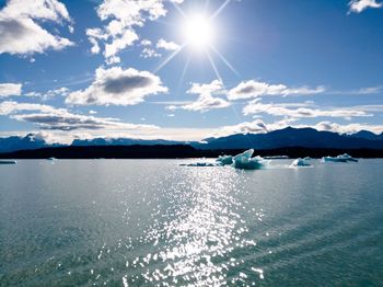 Scenic view of sea against sky on sunny day