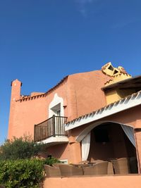 Low angle view of building against blue sky