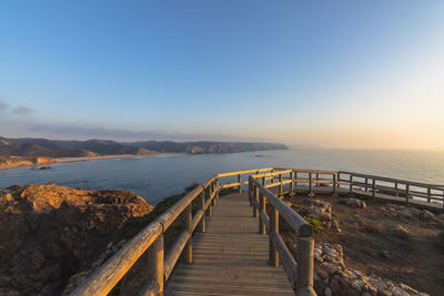 Pier over sea against sky