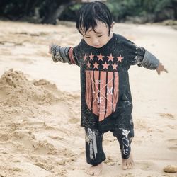 Full length of boy on beach